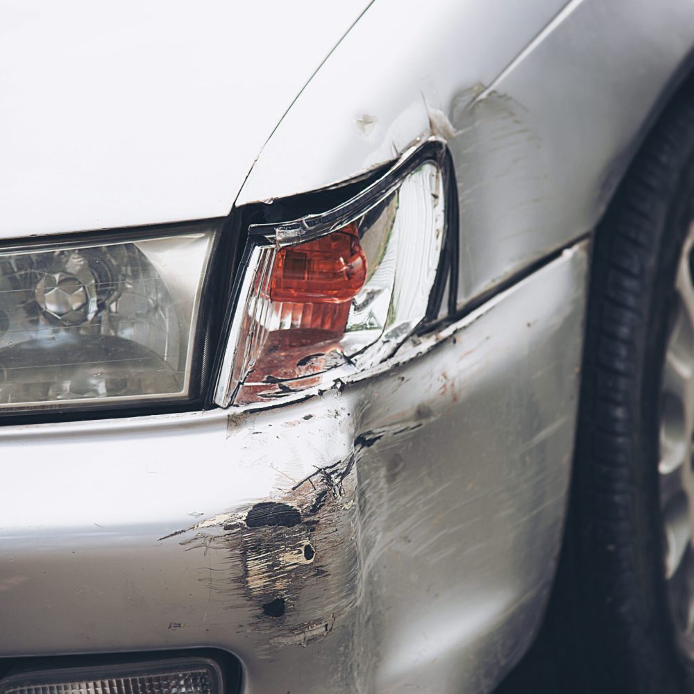 Car damage on road accident - car insurance concept